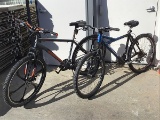 Two bikes (Blue cannondale, gray mongoose)