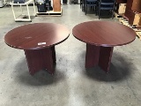 Two wood round tables