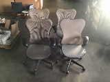 4 brown office chairs