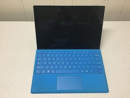 Laptop computer possibly locked, no charger, some damage Microsoft surface
