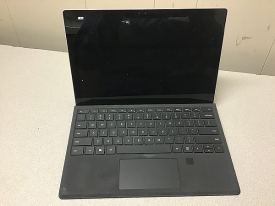Laptop computer possibly locked, some damage,no charger Microsoft surface