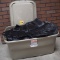 Plastic Tote Full of Black Table Skirting