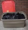 Plastic Tote Full of Black Table Skirting