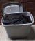Plastic Tote Full of Black Duvetyne