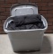 Plastic Tote Full of Black Duvetyne