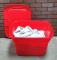 Plastic Tote Full Of Silver Metal Sheen Drapes