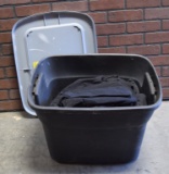 Plastic Tote Full of Black Fabric