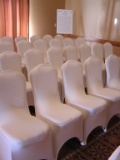 Plastic Tote Full of White Spandex Chair Covers