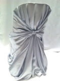 Plastic Tote Full Of Metal Sheen Chair Covers