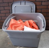 Plastic Tote Full of Crushed Orange Chair Covers