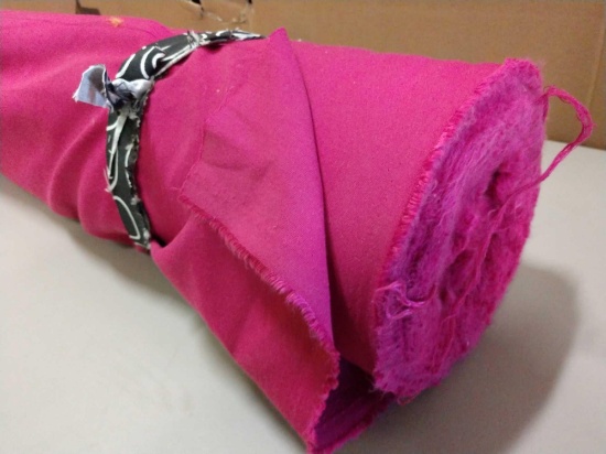 64 inch long roll of pink fabric