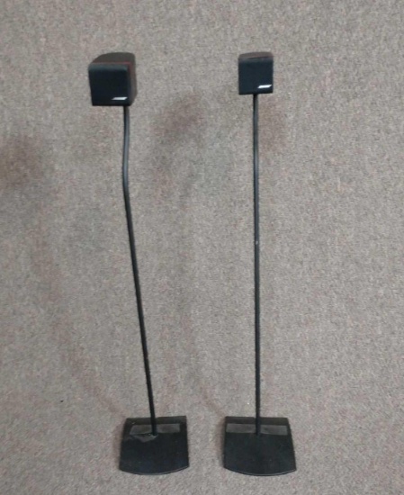 Two Bose cube speakers with stands