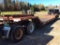 (TITLE) 1975 Talbert 20-ton tandem axle fixed neck lowboy trailer; 18ft well; beavertail w/ ramps;