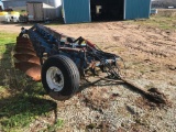 Melroe 7-bottom 18in on land hitch trailer plow w/ spring cushion coulters.
