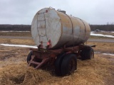 Steel pull type wagon; 70in x 12ft water tank; pintle hitch; dual wheels; 9.00R20 tires.