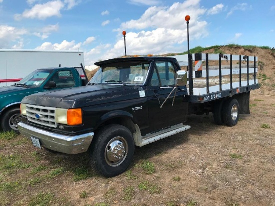 (TITLE) 1989 Ford F-350 flatbed truck; 2x4; V-8 gas; auto; DRW; 12ft flat rack; 2,005 miles showing;