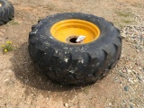 Goodyear 19.5L x 24 tire on 8-hole rim.