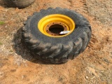 Goodyear 12.5-80-18 tire on 8-hole rim.