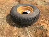 Firestone 11L-16 tire on 8-hole rim.