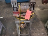 Champion double end grinder on stand.