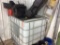250-gallon plastic tote w/ oil equipment.