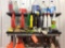 Coat rack w/ cleaning supplies.