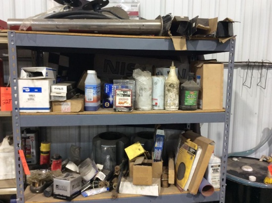 Metal rack w/ heavy truck parts.