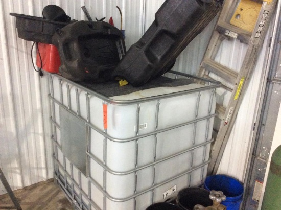 250-gallon plastic tote w/ oil equipment.
