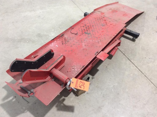 Foot operated motorcycle lift.
