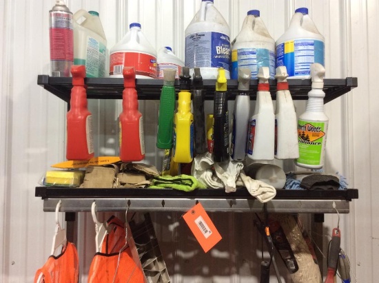 Coat rack w/ cleaning supplies.