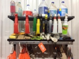 Coat rack w/ cleaning supplies.