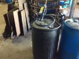 Black barrel w/ hand pump W/ APPROX. 25 GALLONS Pre Dultlited Collant.
