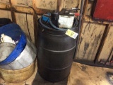Barrel w/ 12 volt diesel transfer drain pump.