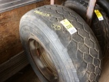 Used 425/65R 22.5 tire on rim.
