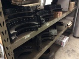 All brake shoes & parts on shelving unit.