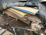 Stack of plywood & misc. on dock.