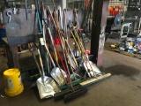 Lot of brooms & shovels.