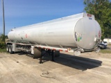 (TITLE) 1999 Heil 8,200-gallon aluminum tandem axle fuel transport trailer; spring ride suspension;