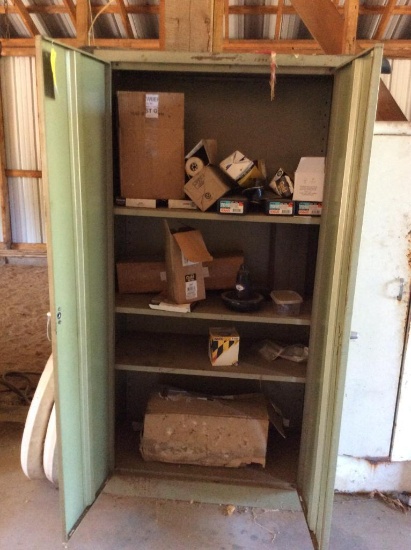 2-door steel cabinet w/ misc. items.