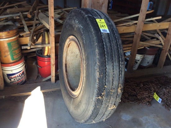 11.00 R20 tire on rim.