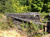 3 - piles of assorted rough sawn lumber.