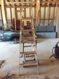 Wood step ladder & hose reel.