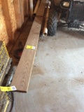 Pile of lumber on floor.