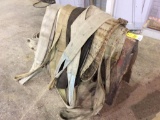 Large lifting straps on saw horse.