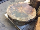 Pallet of tree crosscut slabs.