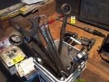 Bucket of large combination wrenches.