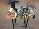 Steel table w/ 5 - vise grip welding clamps.