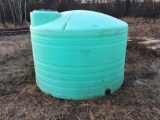 1,500-gallon green plastic tank.