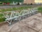 2-20' lattice conveyor sections w/ pallet of rollers.