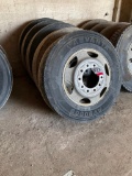 5-285/75R 24.5 tires on alum. rims (5 X the money).